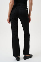 Person wearing black pants on a white background